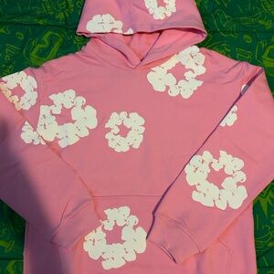 Denim Tears Pink Hoodie with White Floral Design